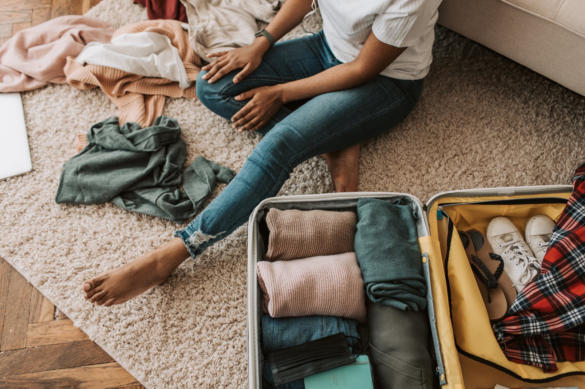 Carry-on essentials include travel documents, change of clothes, valuables, medication, and electronics