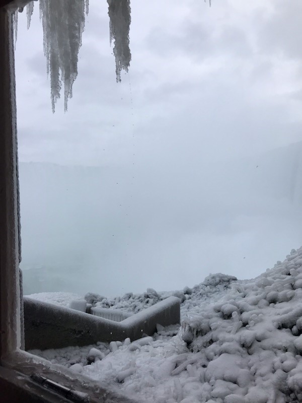 A journey behind the falls is a must do attraction in Niagara Falls during the Winter