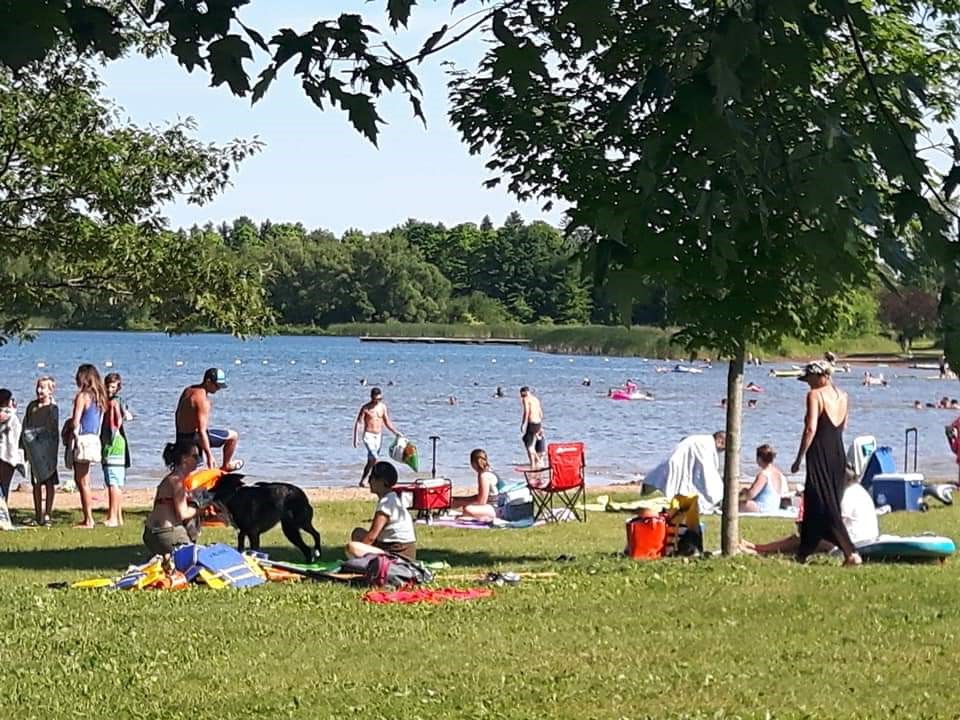 Valen's Conservation has both a sand and grass beach area with plenty of shade