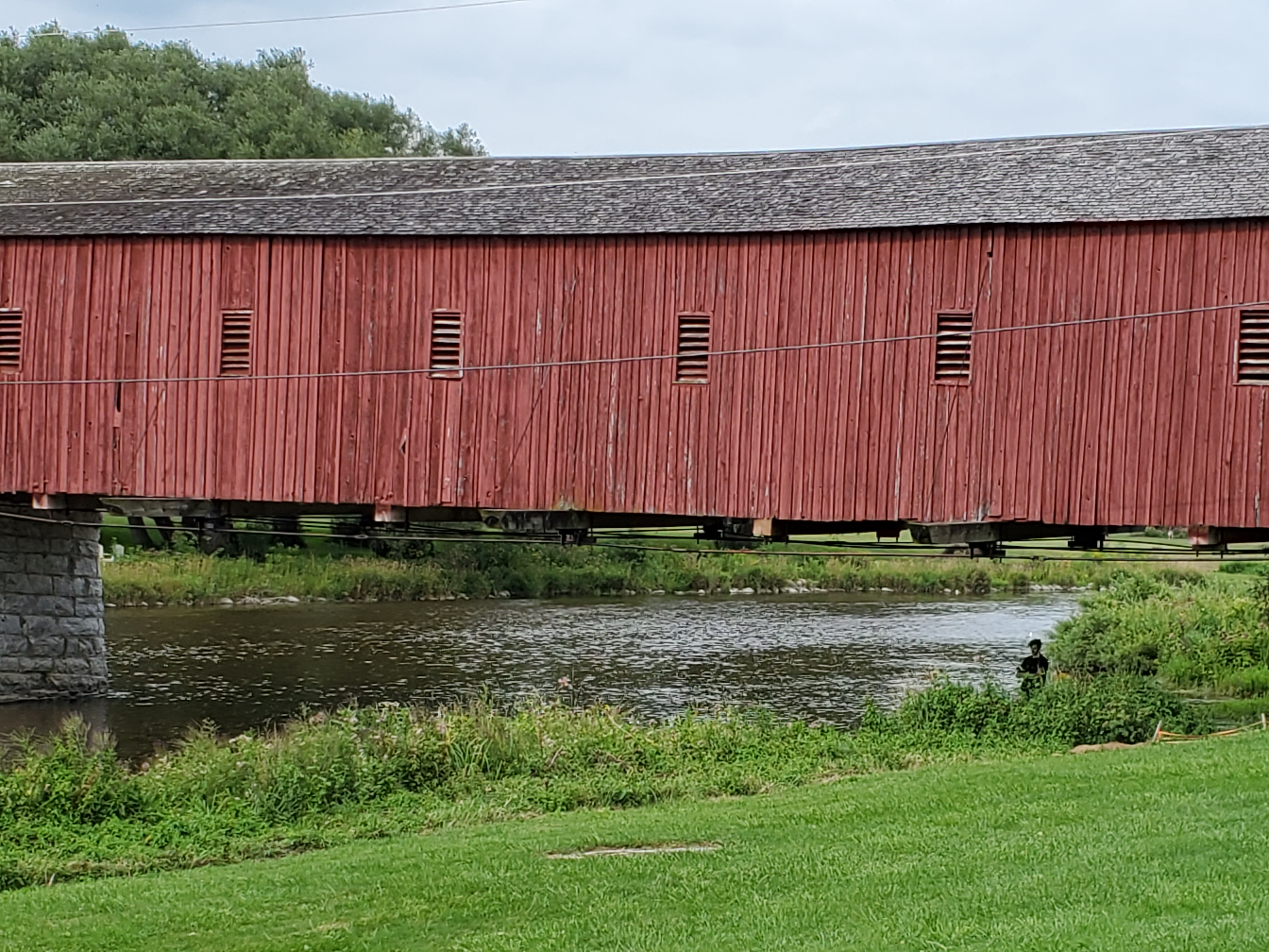 Bring your fishing pole when visiting the West Montrose Kissing Bridge, the longest covered bridge in Ontario, Canada