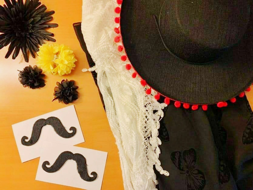 A fake mustache and Spanish hat make for great photo booth props