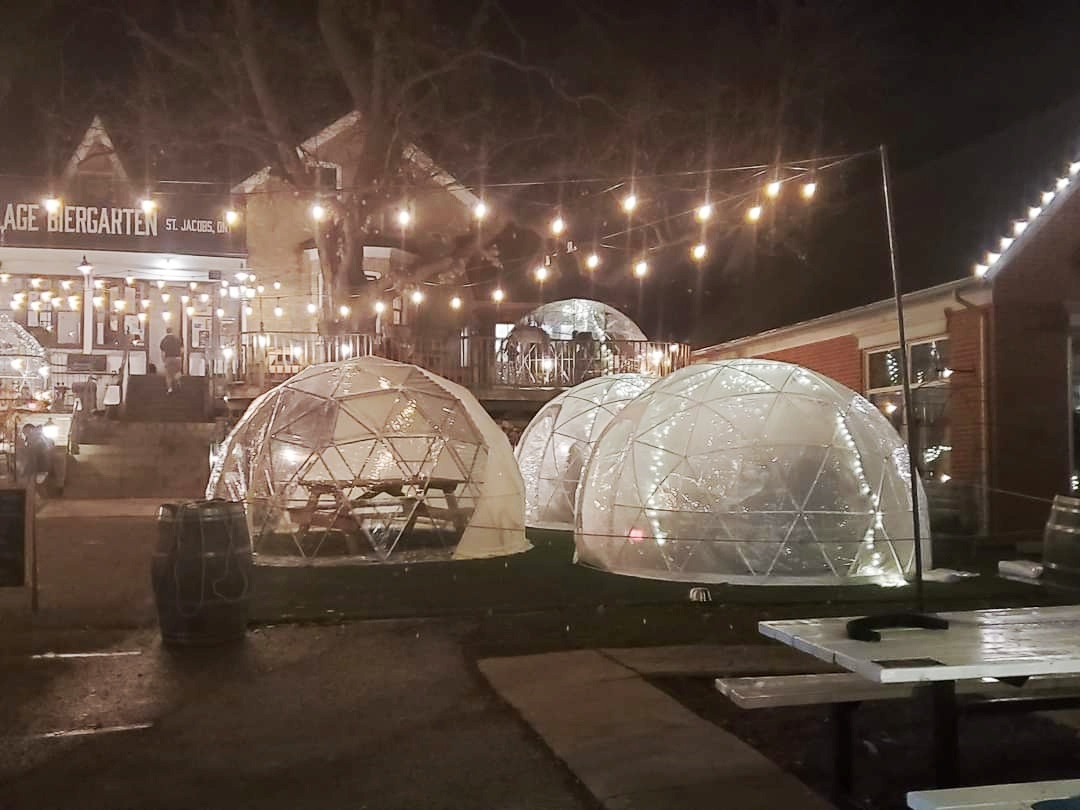 Make a reservation to dine in the dome tents at the Village Biergarten in St. Jacobs, Ontario