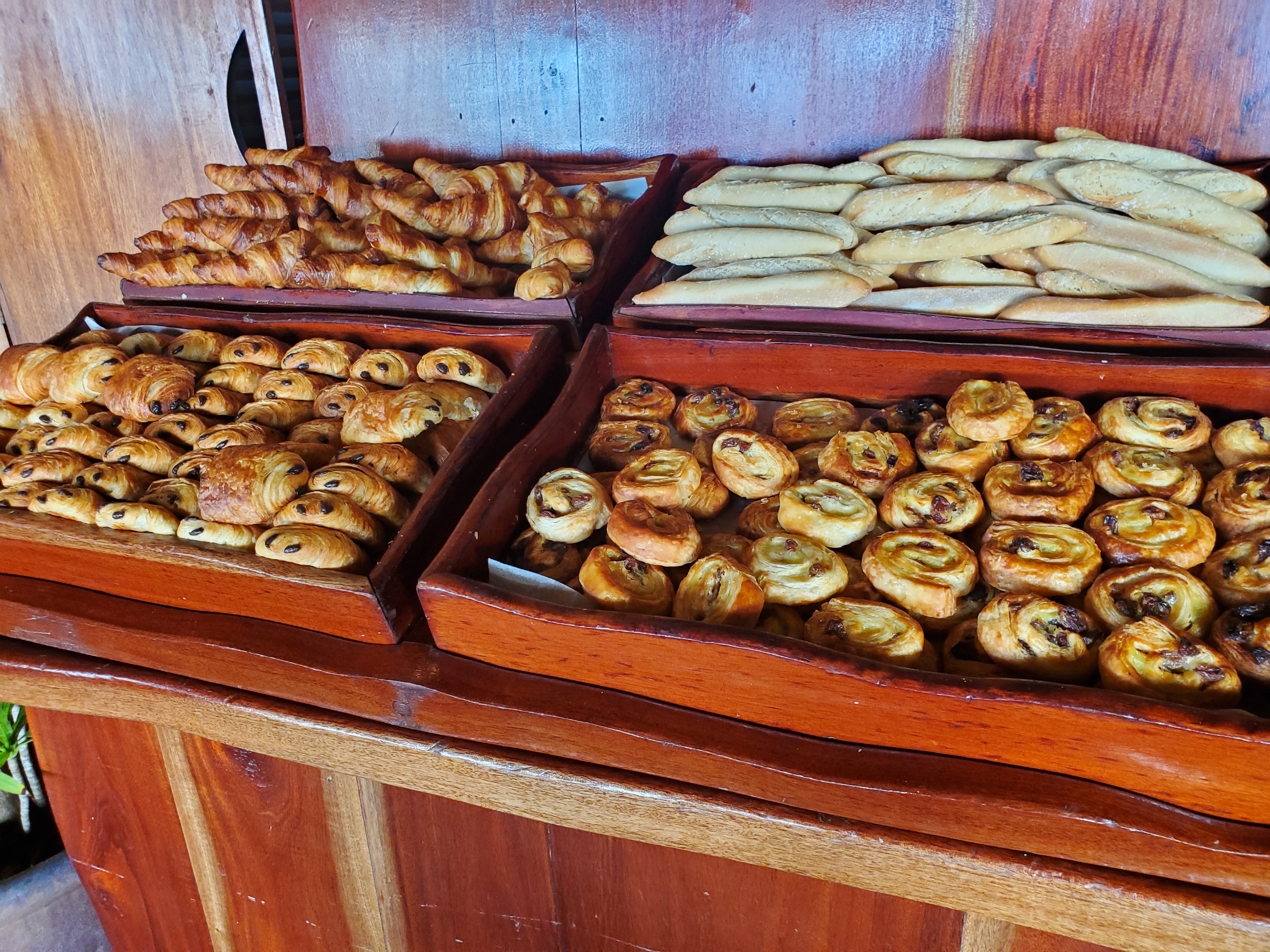 The breakfast buffet at Sofitel Kia Ora Beach Resort offers a variety of bread and pastries