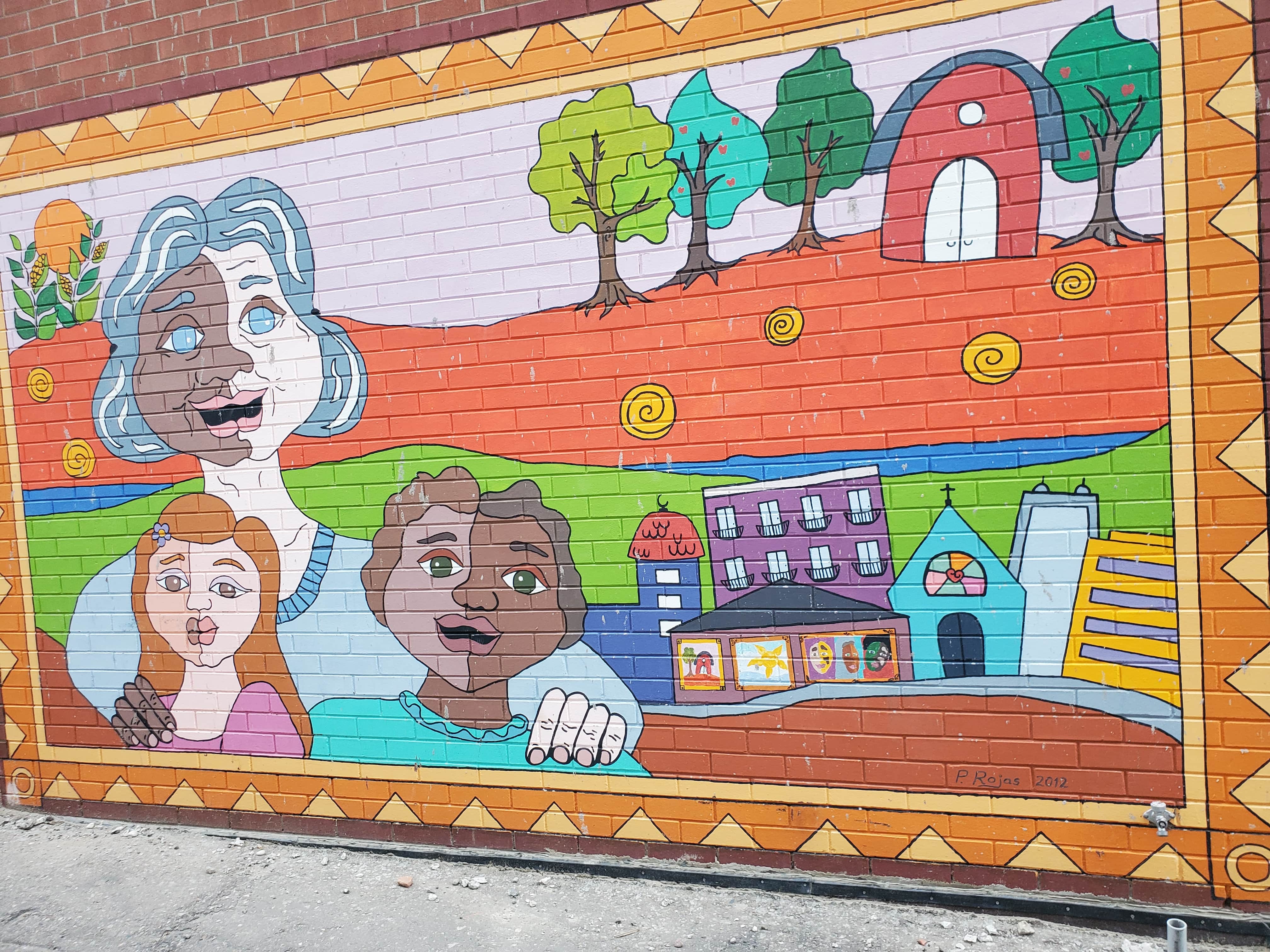 The Grandmother's Love mural can be found in a small alleyway accessed from  King Street in downtown Kitchener