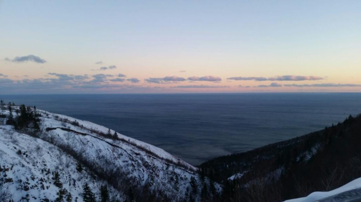 The view of the ocean and the Cabot Trail highway make the Skyline Trail one of the best Canadian hikes to do during the Winter