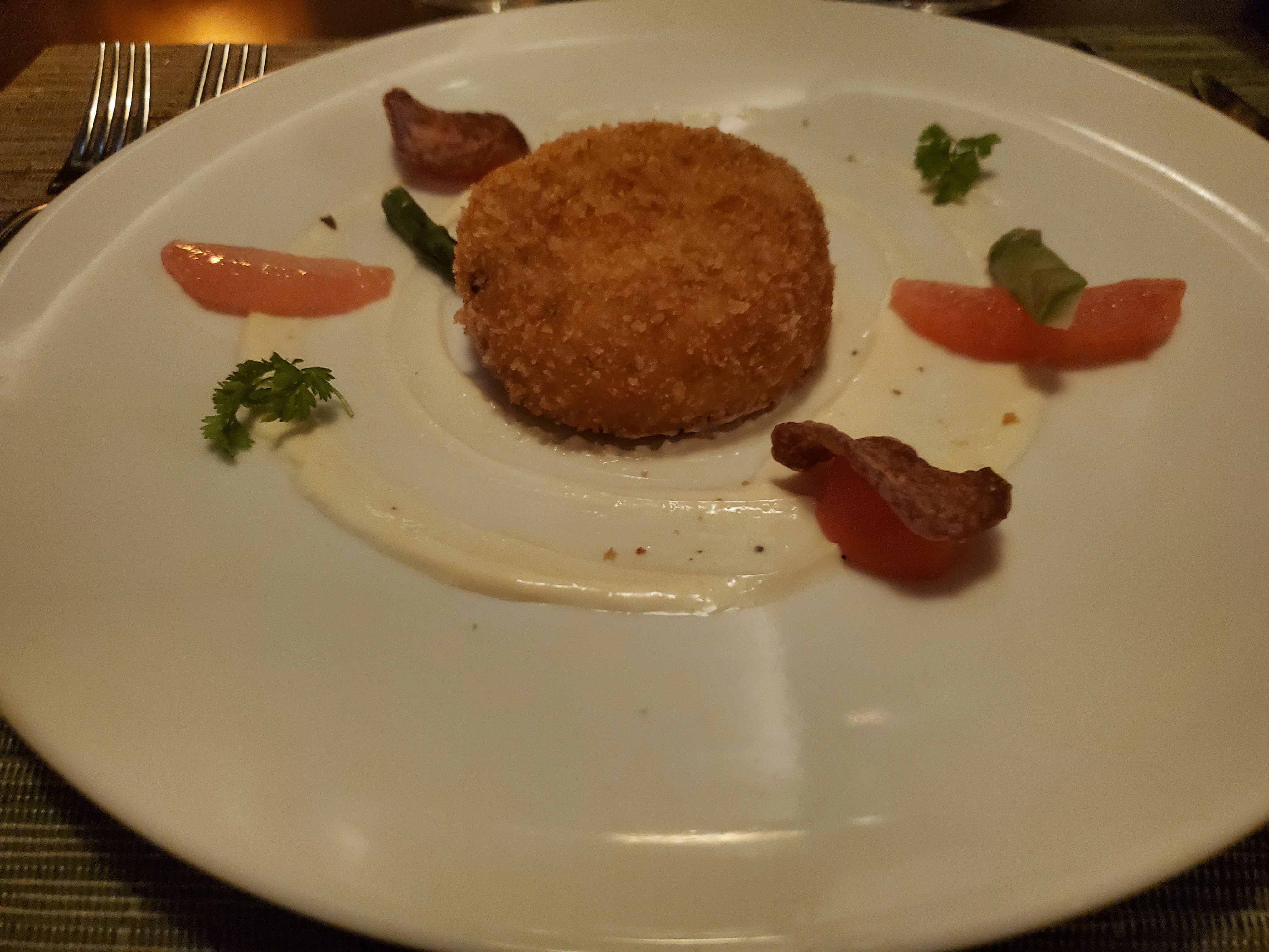 Enjoying a crab cake appetizer at the Steakhouse Specialty Restaurant on the Celebrity Beyond