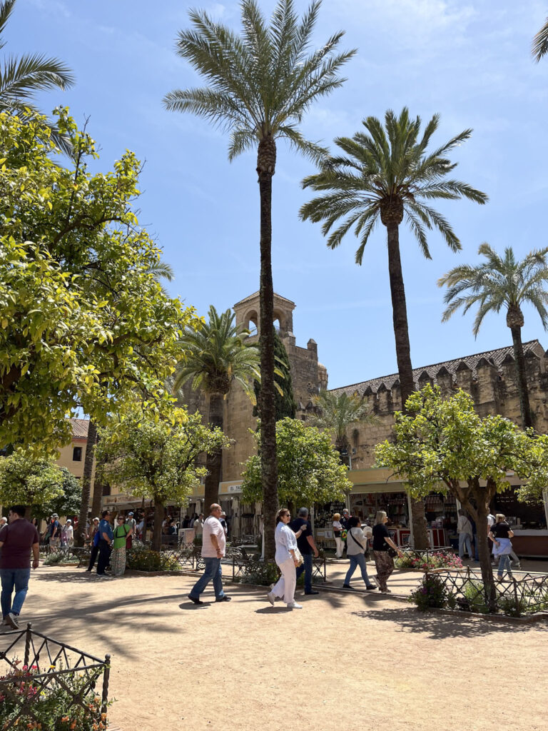 Don't accept gifts from strangers when visiting Spain.  There are people who will try to sell items.  Politely refuse and keep walking.